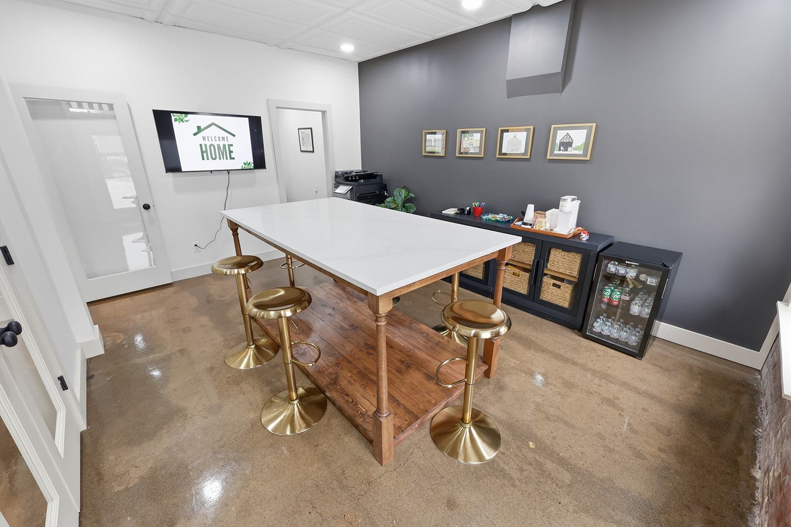 Polished floors, exposed brick, gold accents